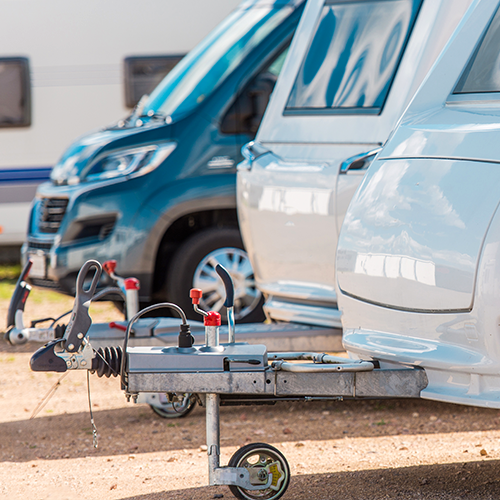 Parked RVs and trailers outdoors